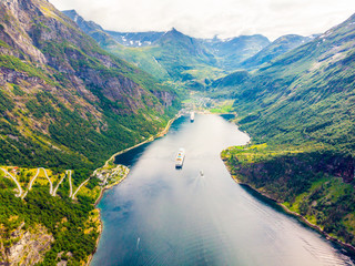 Fjord Geirangerfjord with ferry boat, Norway.