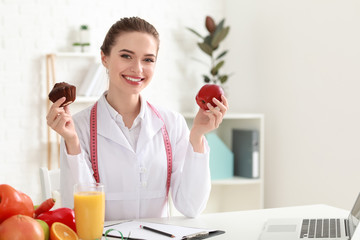 Portrait of female nutritionist in her office