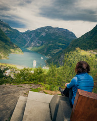 Tourist enjoying Geirangerfjord from viewing point