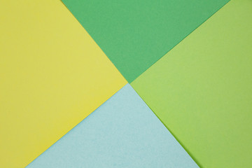 sheets of colored paper. Many colored sheets of paper are laid out in the harsh composition. background of colored paper.