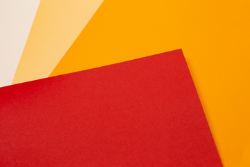 sheets of colored paper. Many colored sheets of paper are laid out in the harsh composition. background of colored paper. warm colors