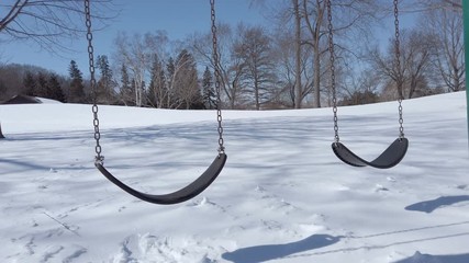 Empty swing. Winter, cold weather, outdoor
