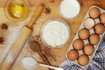 Food ingredients for baking: flour, eggs, milk, sugar