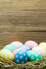 Easter eggs on wooden background, Christian holiday of celebrates the belief in the resurrection of Jesus Christ