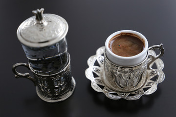 Traditional Turkish coffee in traditional silver cup with silver pot and tray .Turkey 