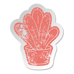 distressed old sticker of a green indoor plant