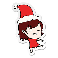sticker cartoon of a undead vampire girl wearing santa hat