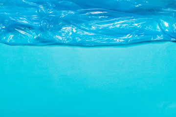 Background of blue plastic package. The concept of using environmentally friendly packaging