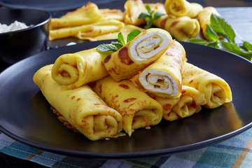 crepes roll up filled with sweet white cheese