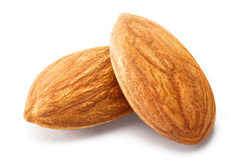 Close-up of two almonds, isolated on white background