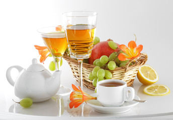 Still life with a beautiful bouquet of flowers and a glass of wine