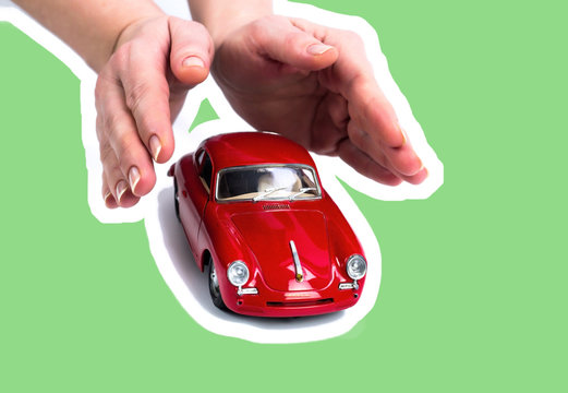Image with a red sports car model in a savings concept to buy a car or insure travel. Hand with a car. Car dealership and rental concept magazine collage background. 