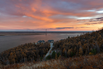 Obraz premium Dramatic heaven and magic reflection on the Lena river. Beautiful colorful natural sunset or sunrise over one of the greatest rivers Lena, Yakutia, Russia