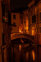 Long exposure. View of the bridge over canal in Venice, Italy, at night.