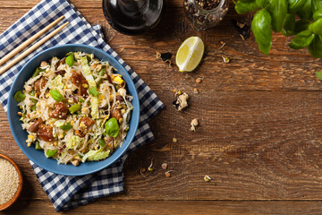 Fried veal, with rice, Chinese cabbage and mushrooms. Sprinkled with sesame and soy sauce.