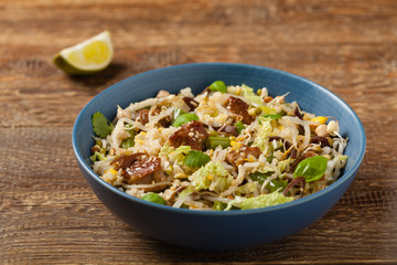 Fried veal, with rice, Chinese cabbage and mushrooms. Sprinkled with sesame and soy sauce.