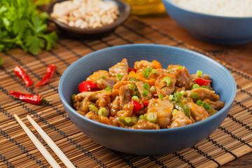Chicken kung pao. Fried chicken pieces with peanuts and peppers.