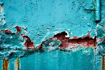 The background is corrosion and metal chipping, erosion, scattering, rust of green paint corroded close up.