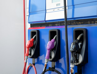 closeup colorful Hand refilling the car with fuel at the refuel station,on white background