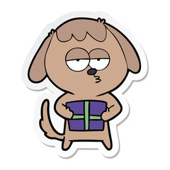 sticker of a cartoon bored dog with christmas present