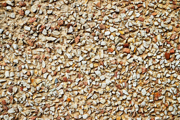 The surface of fine reddish yellow gravel for the background, wallpaper, design from above.