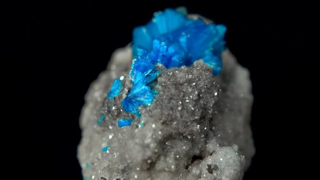 Seamlessly rotating a sky blue mineral (Cavansite) in front of black background