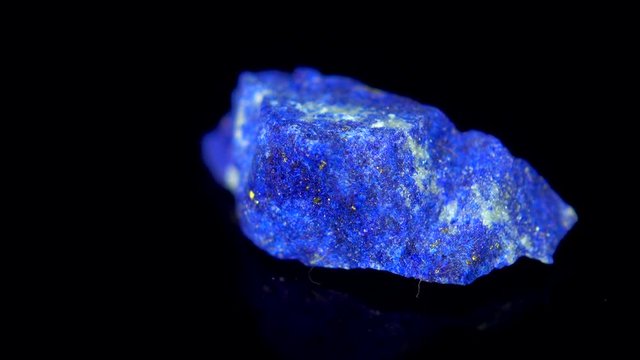 Seamlessly rotating a blue mineral (Lapis Lazuli) in front of black background