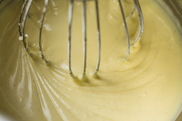 Kitchen aid mixing thick and creamy vanilla cream.