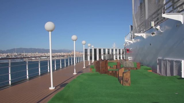 view of the deck of the cruise ship with swimming pool and animation