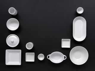 white, modern tableware in various designs on a black background