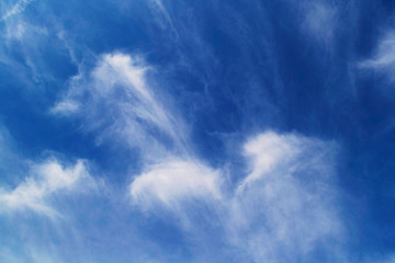 Blue sky with clouds. Bright background with place for text.