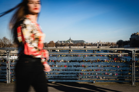 Young woman on a parisian bridge