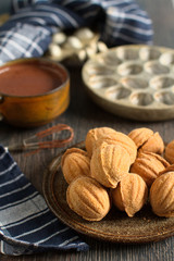 Russian walnut shaped cookies with caramely filling – “Oreshki”