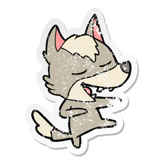 distressed sticker of a cartoon wolf laughing