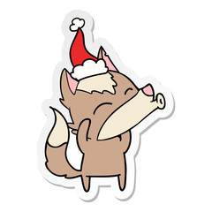 howling wolf sticker cartoon of a wearing santa hat
