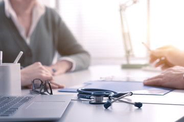 Woman meeting the doctor in the office for a consultation