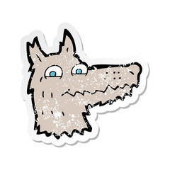 retro distressed sticker of a cartoon wolf head