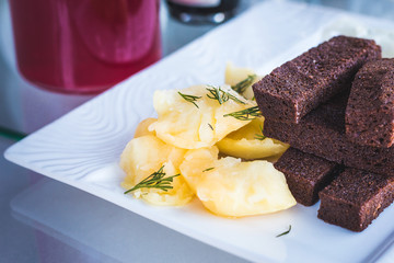 Food shot of a tasty dish with potato and bread