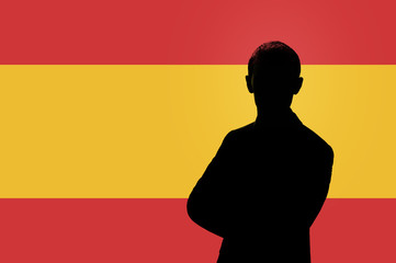 Silhouette of businessman on the background of the Spanish flag.