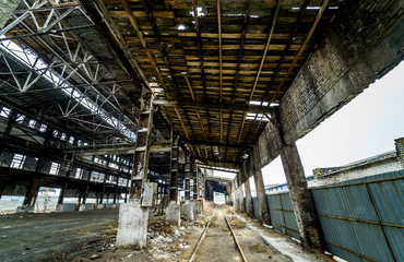 Abandoned ruined industrial factory building, ruins and demolition concept.