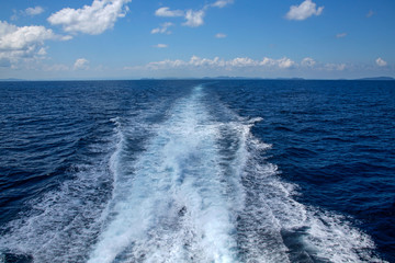 waves of water behind high speed catamaran on Thailand Gulf
