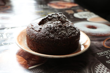 chocolate cake with cup of coffee on wooden table