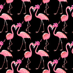 Two pink flamingos on a black background. Seamless pattern.