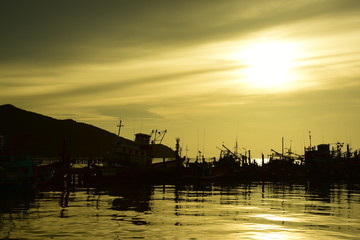 Fishing port view before sunset With beautiful golden yellow sky