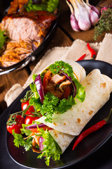 Tasty wraps filled with pulled pork and salad