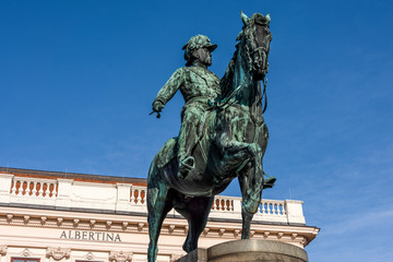 Obraz premium Austria, Vienna, Albrechtsplatz: Front view of world famous Albertina museum palais palace with Albrecht statue in the city center of the Austrian capital with blue sky - concept travel history art