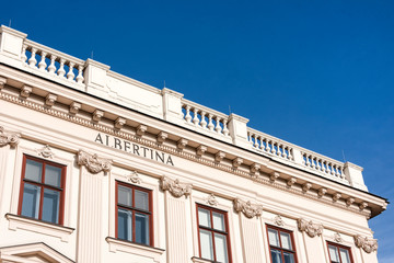 Austria, Vienna, Albrechtsplatz: Front view of world famous Albertina museum palais palace in the city center of the Austrian capital with blue sky - concept travel history art architecture Habsburger