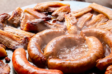 Baking traditional homemade delicious meat on barbecue plate