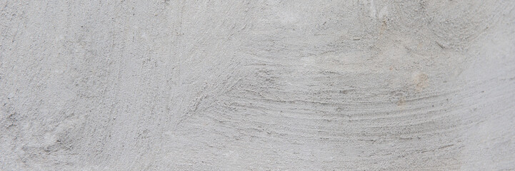gray cement plaster on the wall of the house.