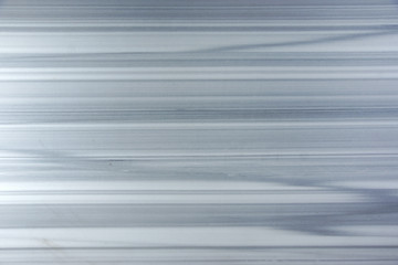 An interesting white marble stone with gray parallel stripes resembling a zebra is called Zebrino.